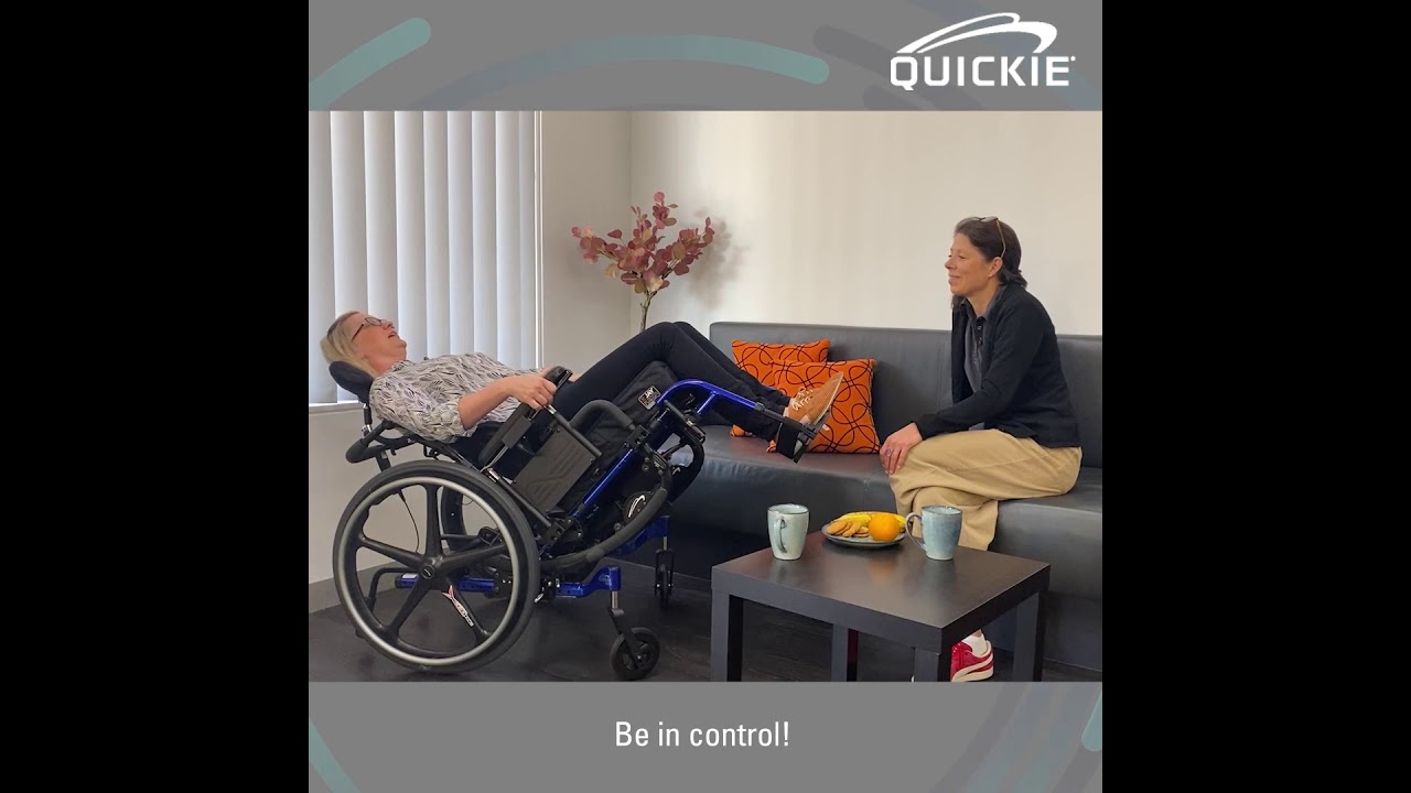 Quickie Iris wheelchair with power tilt, displayed in a seated user scenario, emphasising postural management and comfort