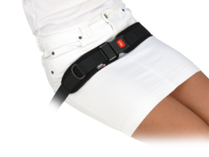 Woman in white skirt safely secured with a black Spex 2-point dual centre pull padded hip belt with red release button.