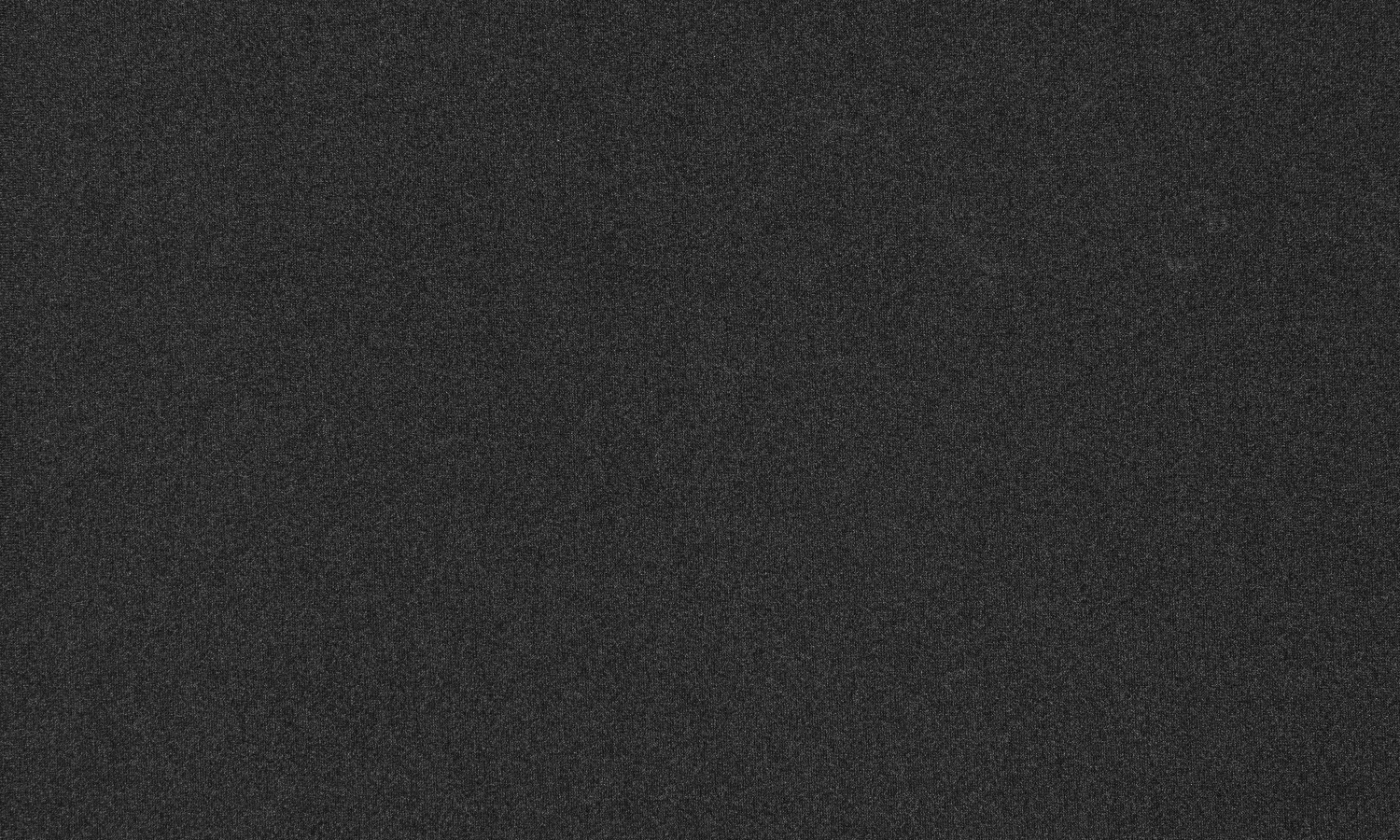Close up on dark grey custom Spex knitted fabric, designed for breathability and machine washing.