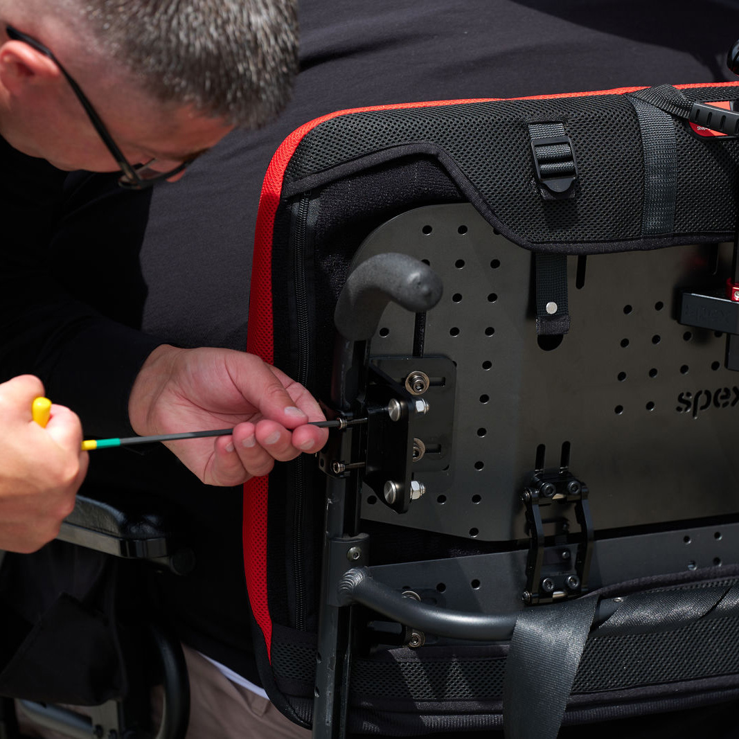 Xlella hardware in rear view, showing reinforced mounting and adjustable postural support for bariatric users.