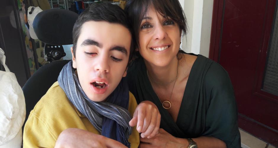 Afonso with his caregiver.