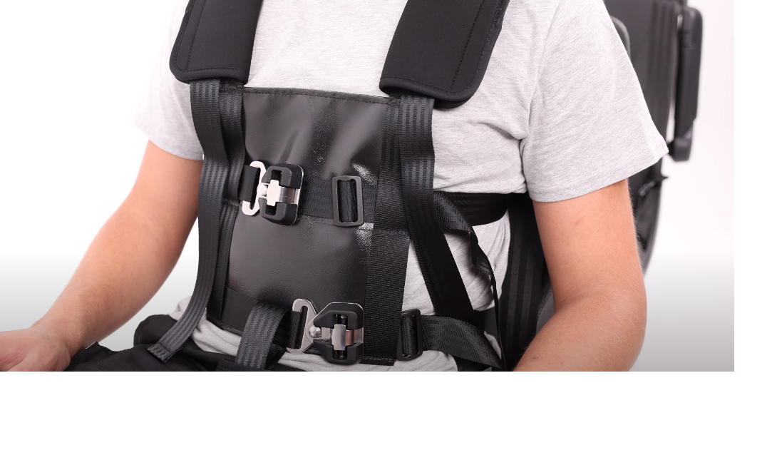Man strapped into a Houdini harness.