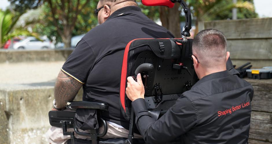 Bruce adjusting a wheelchair
