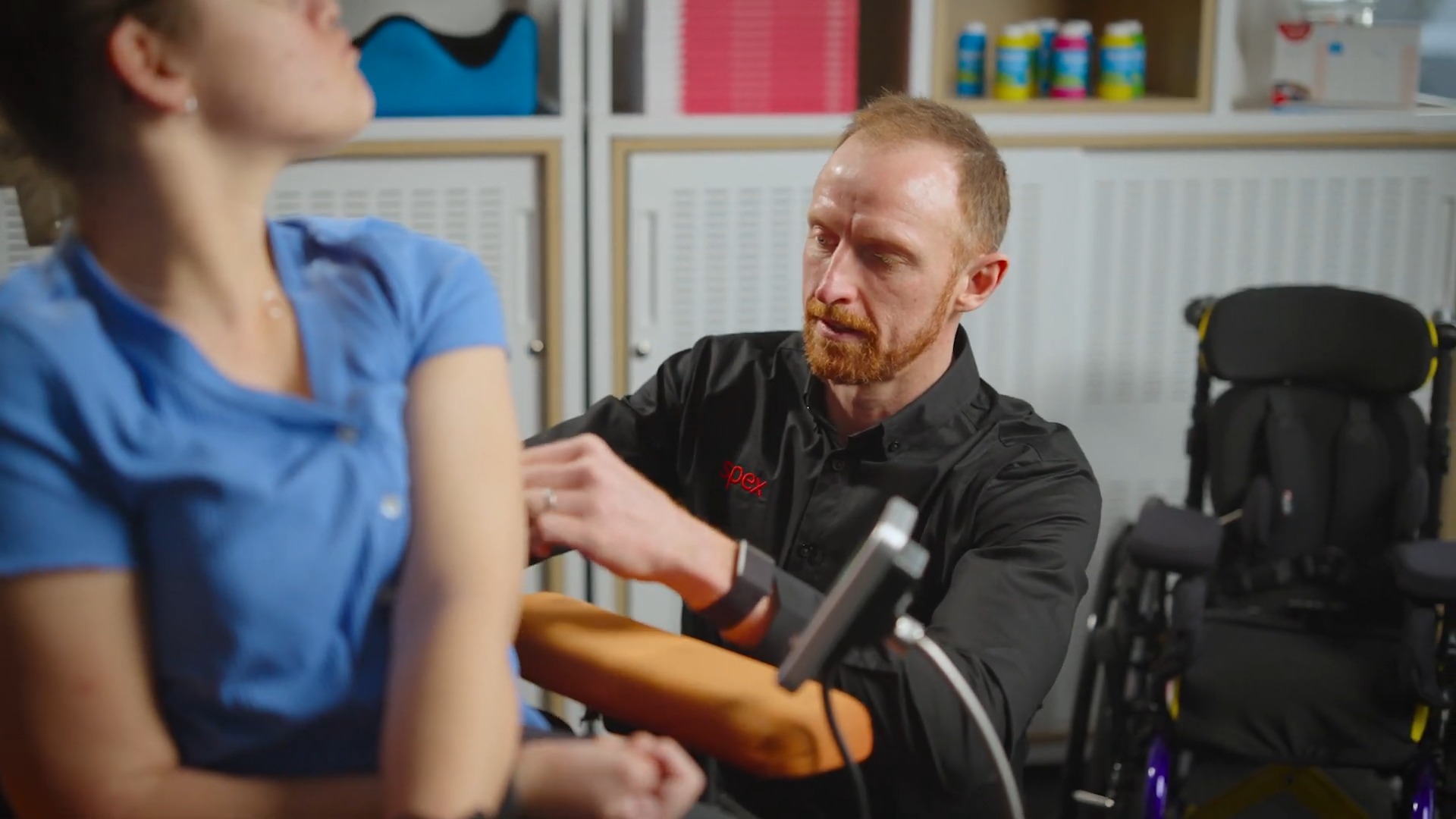Ross Andrews, Product Specialist, adjusting a wheelchair