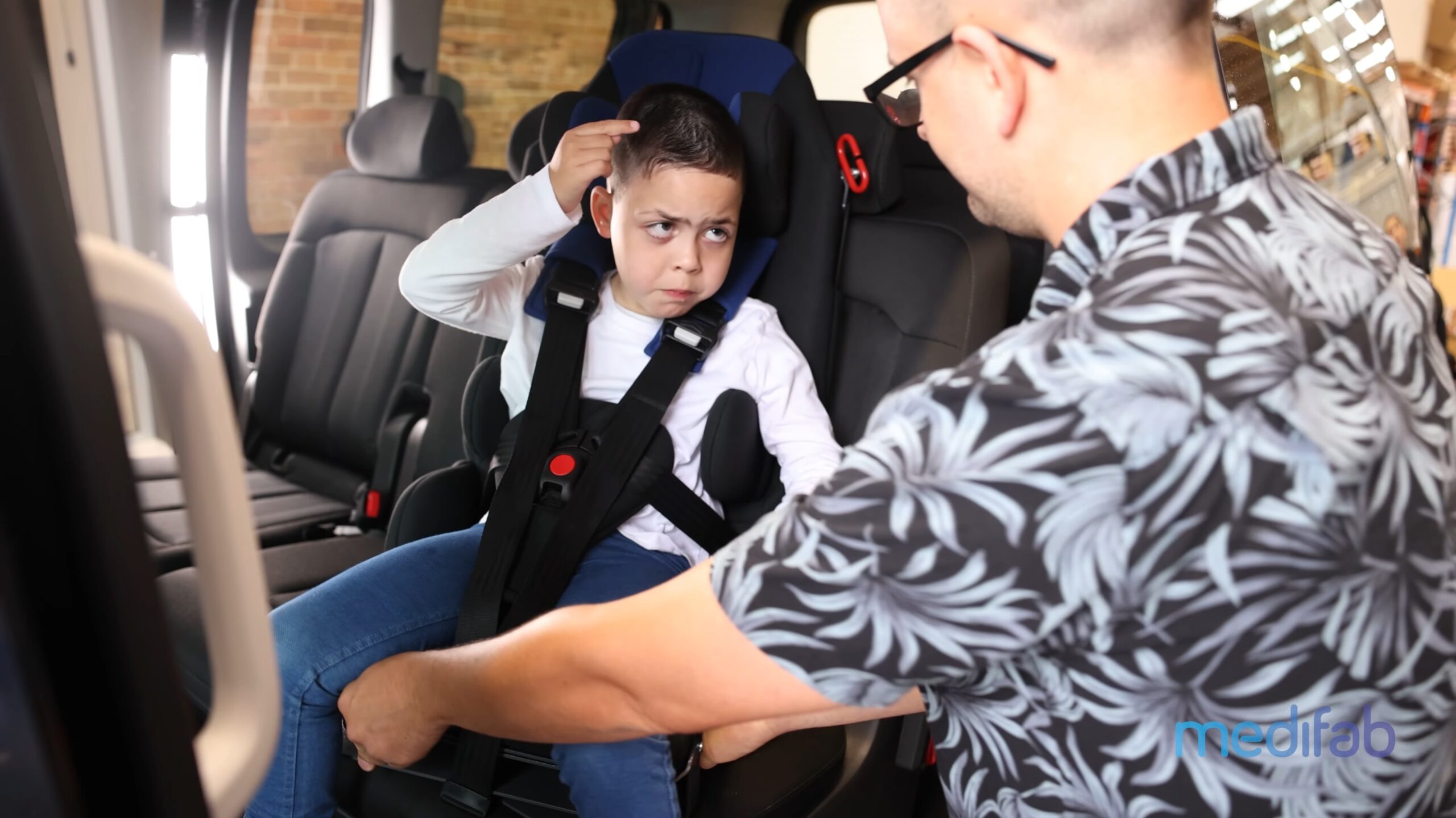 Young boy buckled into a Kidsflex Car Seat