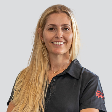 Corporate headshot of lady named Sofia Bello on a grey background.