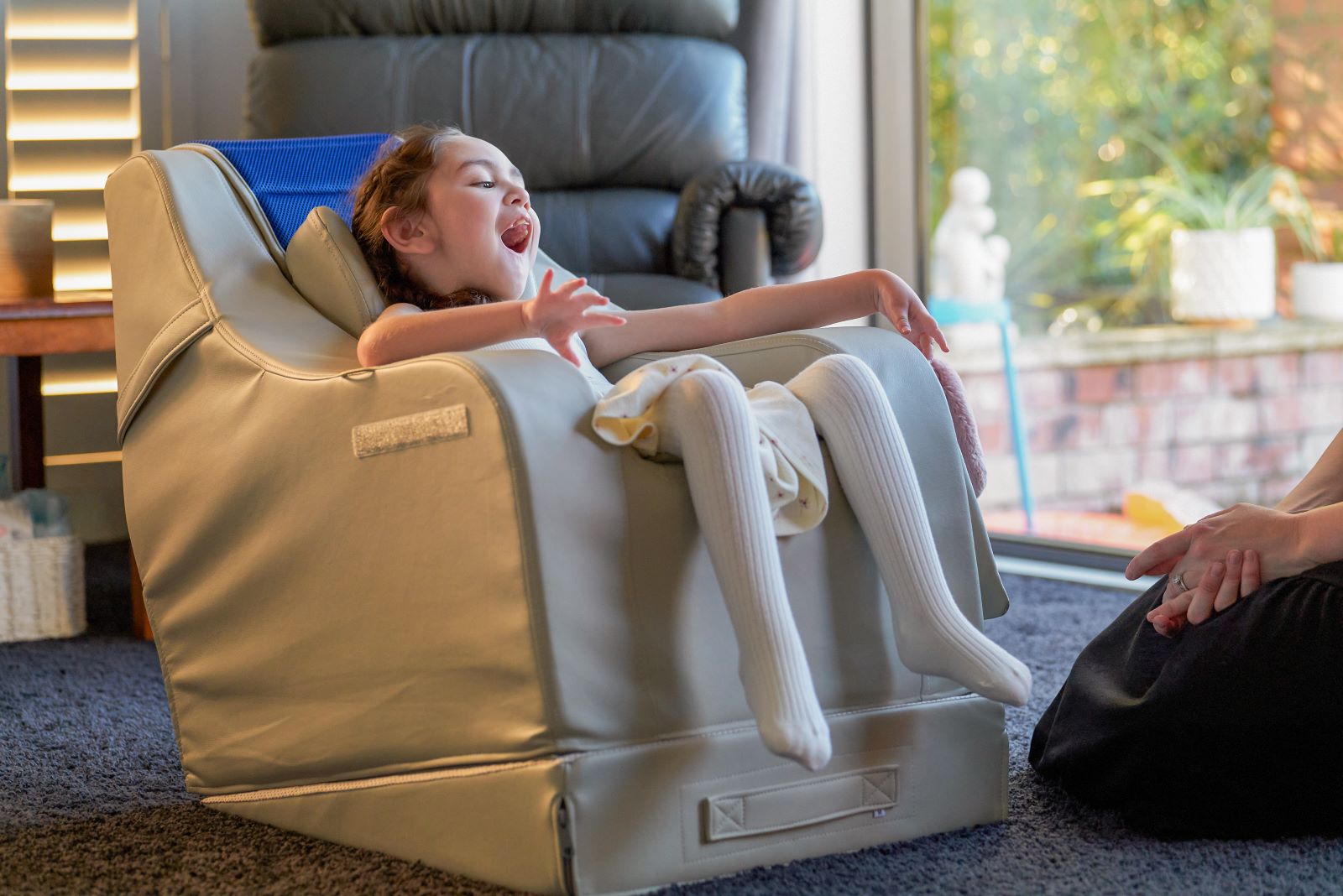 Hazel relaxes in a Medifab Gravity Chair, enjoying tailored support and pressure relief for better comfort throughout the day.