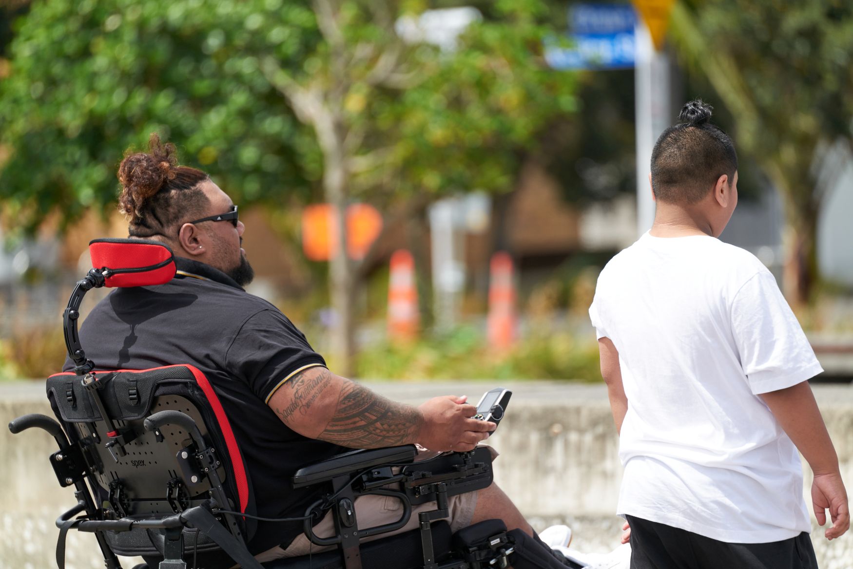 Power Wheelchair user with Spex XLella back support and Stylo head support